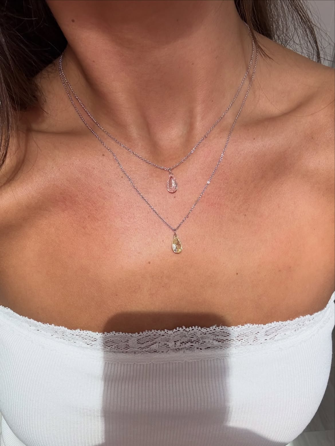 Pink and yellow Floating Diamonds necklaces worn together