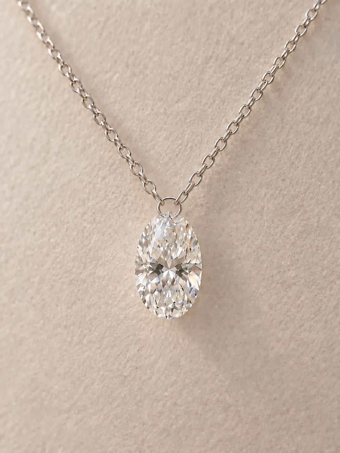 White oval diamond necklace with a white gold chain